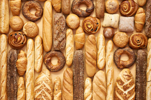 Bread baking rolls and croissants as a background